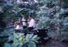 1971-07-00:Snow Hugh Wedding Jeep in woods
